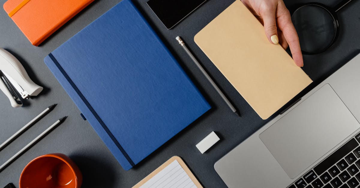 A teacher updating private course materials at a clean desk.