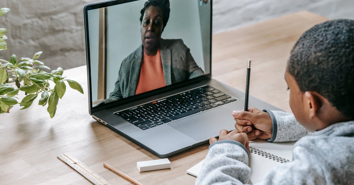 A private lesson onboarding checklist beside a laptop.